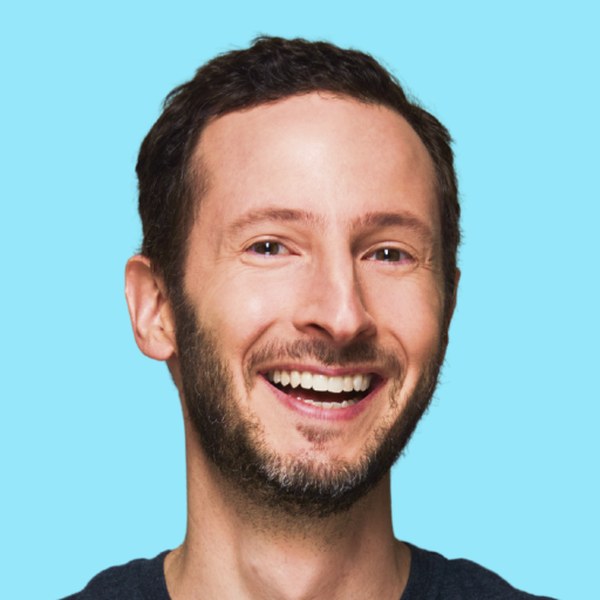 Portrait of Jason Feifer, keynote speaker at The Practical AI Conference